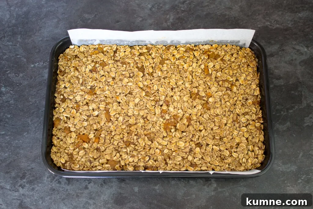 Chewy Apricot and White Chocolate Flapjack Recipe for Snacktime 10 Flapjack pressed into a lined tin