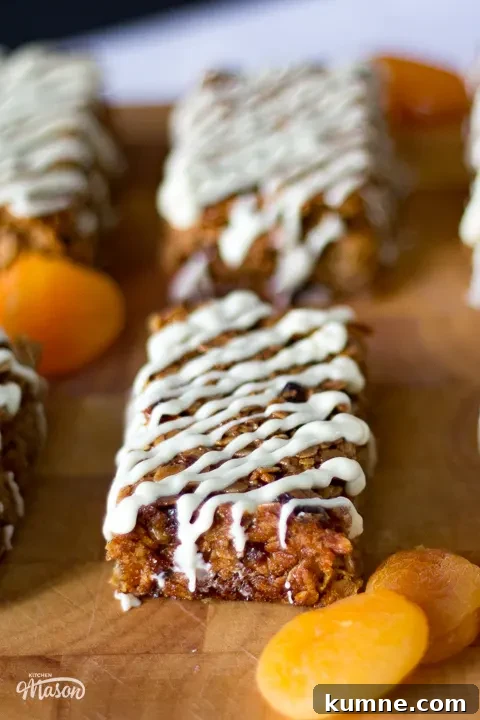 Chewy Apricot and White Chocolate Flapjack Recipe for Snacktime 3 Dried apricot and apricot white chocolate flapjacks on a wooden board