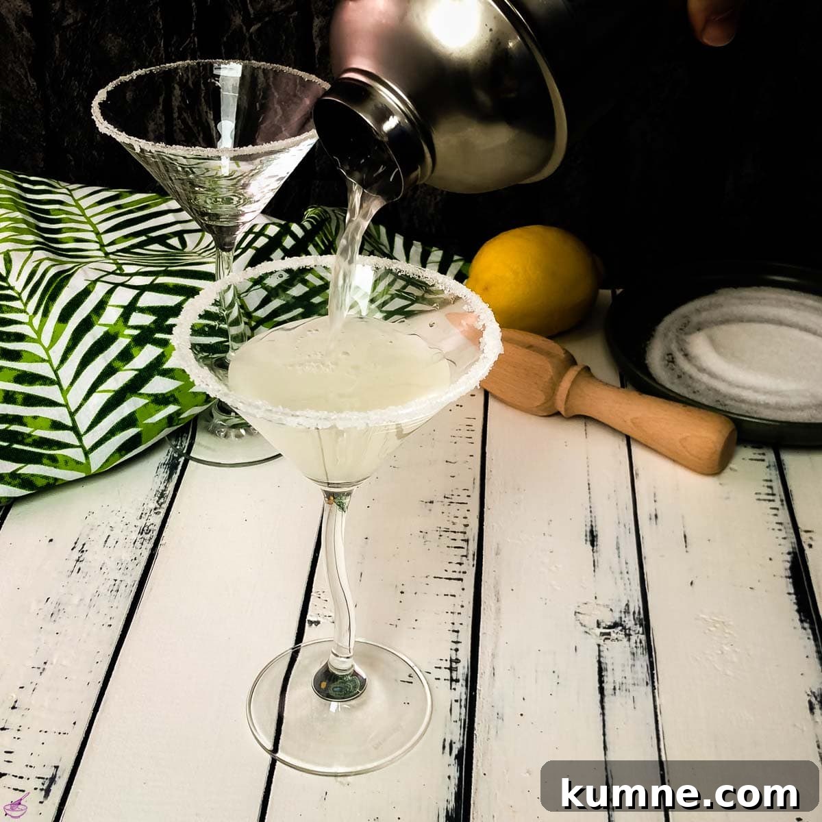 Gorgeous cocktail glass with a sugar rim filled with a delicious vodka sidecar.