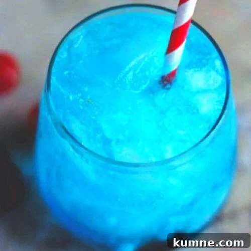 Blue cocktail with a red and white straw.