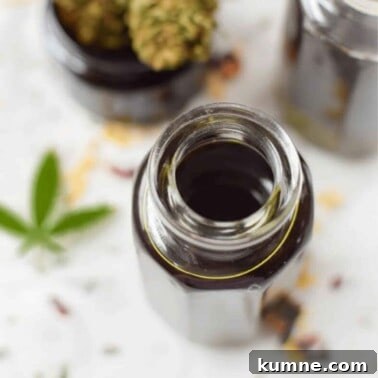 A glass bottle filled with cannabis massage oil.