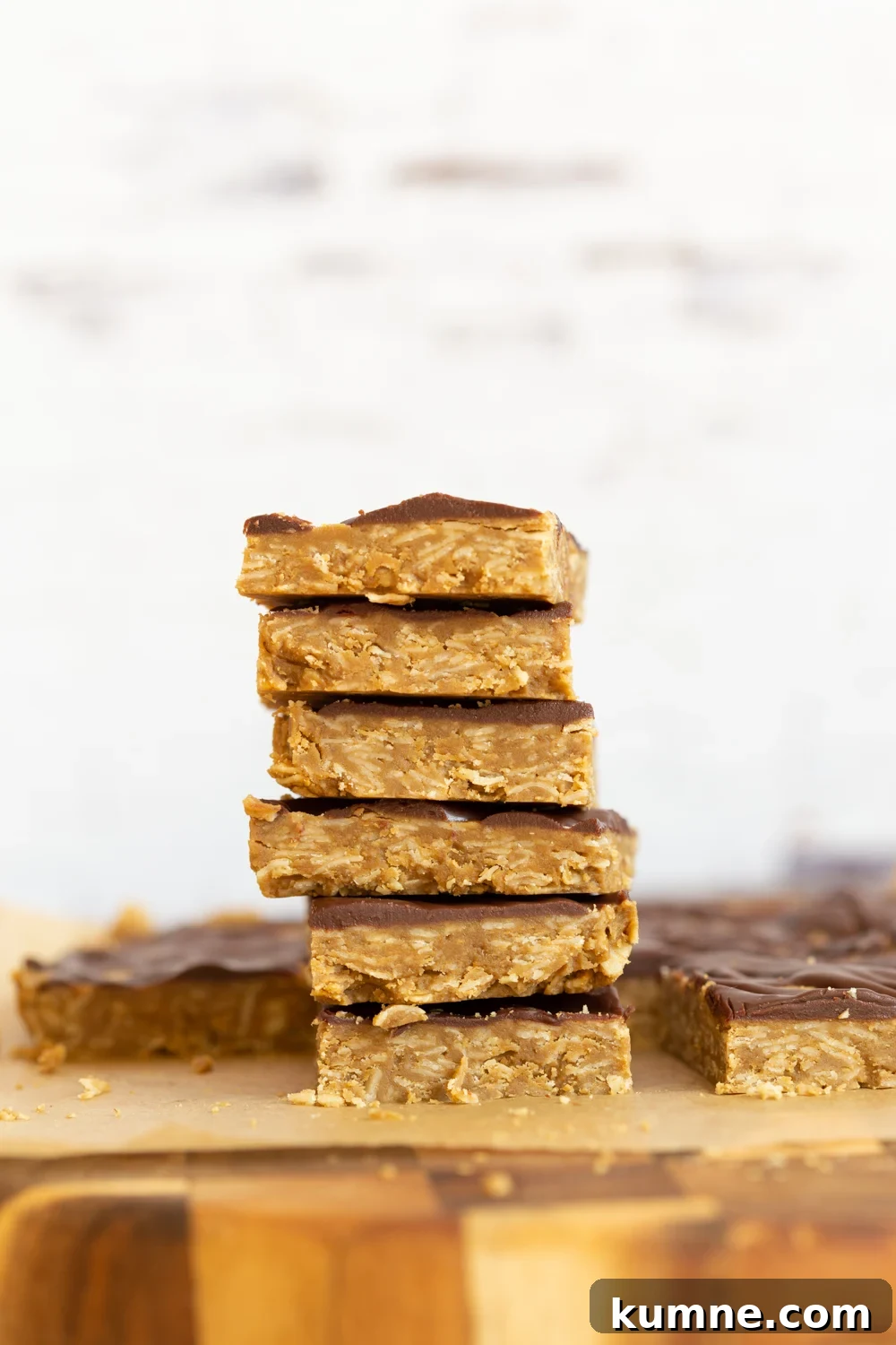 Sliced Sunbutter Granola Bars stacked on wood board