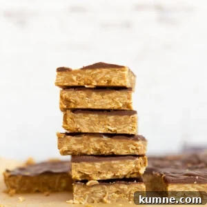 Sliced Sunbutter Granola Bars stacked on wood board