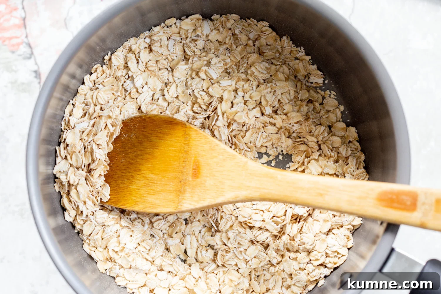 Oats toasted for our Vegan sunbutter Granola Bars in a saucepan 