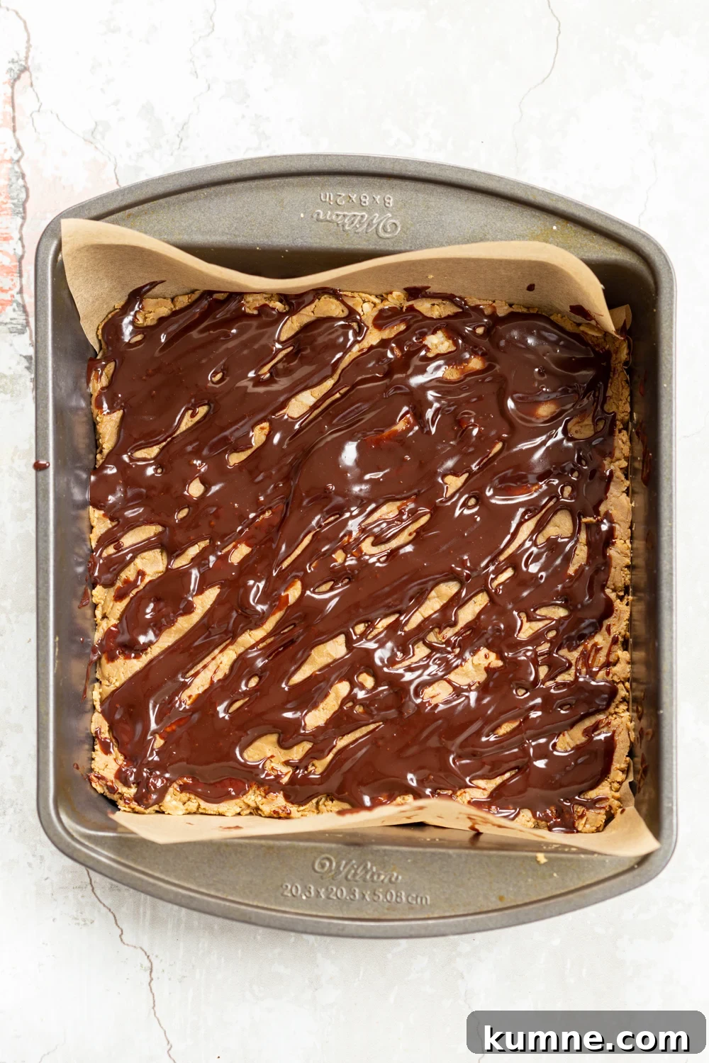 Chocolate drizzle on our vegan sunbutter granola bars in a grey dish