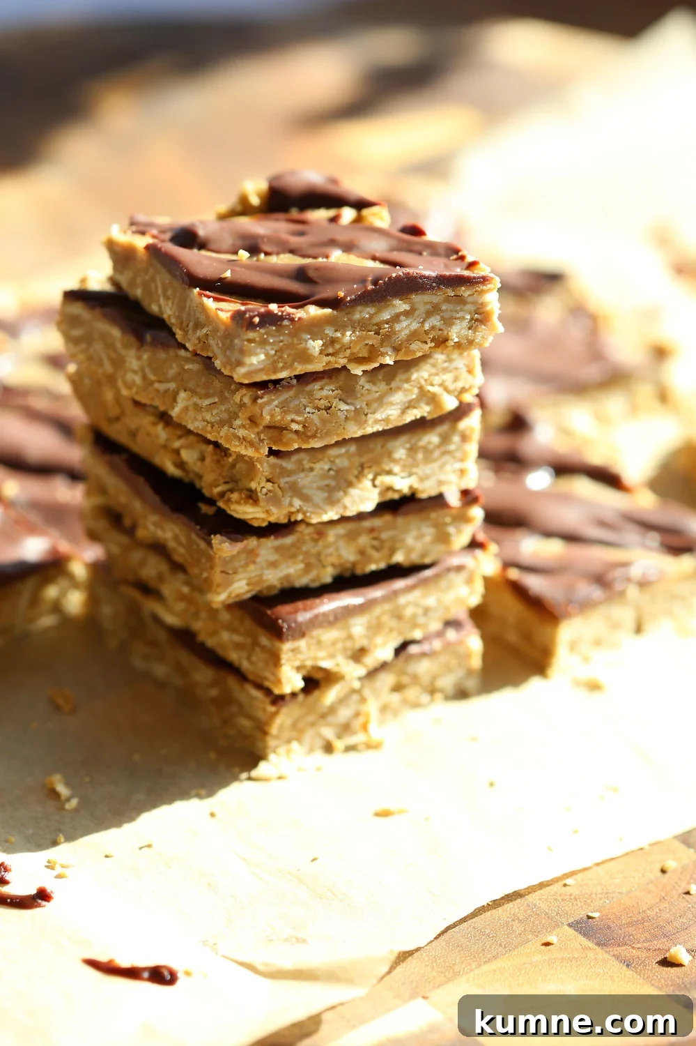 Our Vegan Sunbutter Granola Bars stacked on top of each other on a wood board
