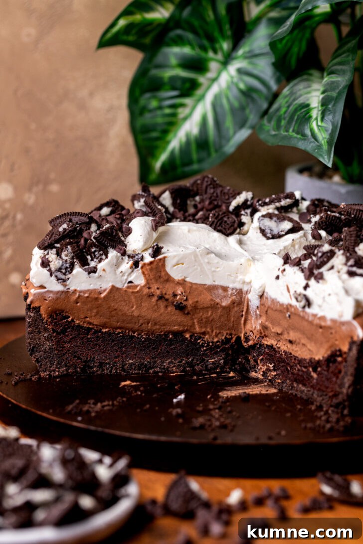 Decadent Mississippi Mud Pie Recipe — Classic Chocolate Dessert 3 Mississippi mud pie split open on a wood board.