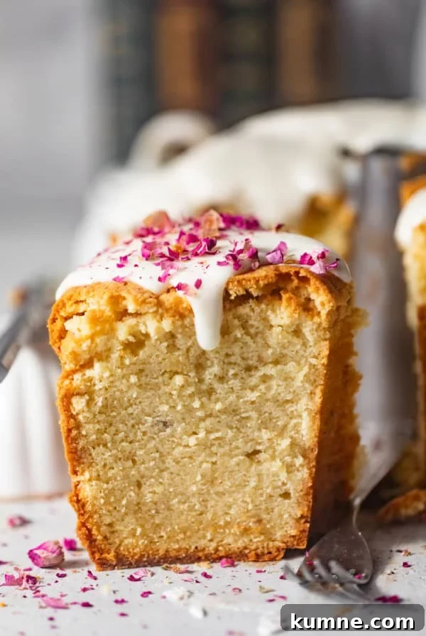 Homemade Banana Pudding Recipe: Classic from Scratch 12 a slice of cream cheese pound cake on a white surface with rose petals on top.