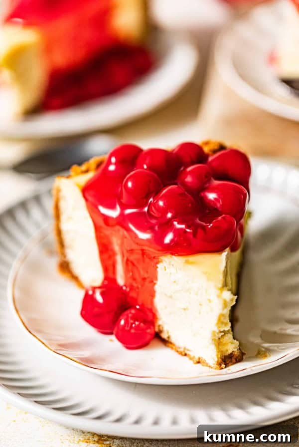 Homemade Banana Pudding Recipe: Classic from Scratch 14 a slice of cherry cheesecake on a white plate covered in cherry pie filling.