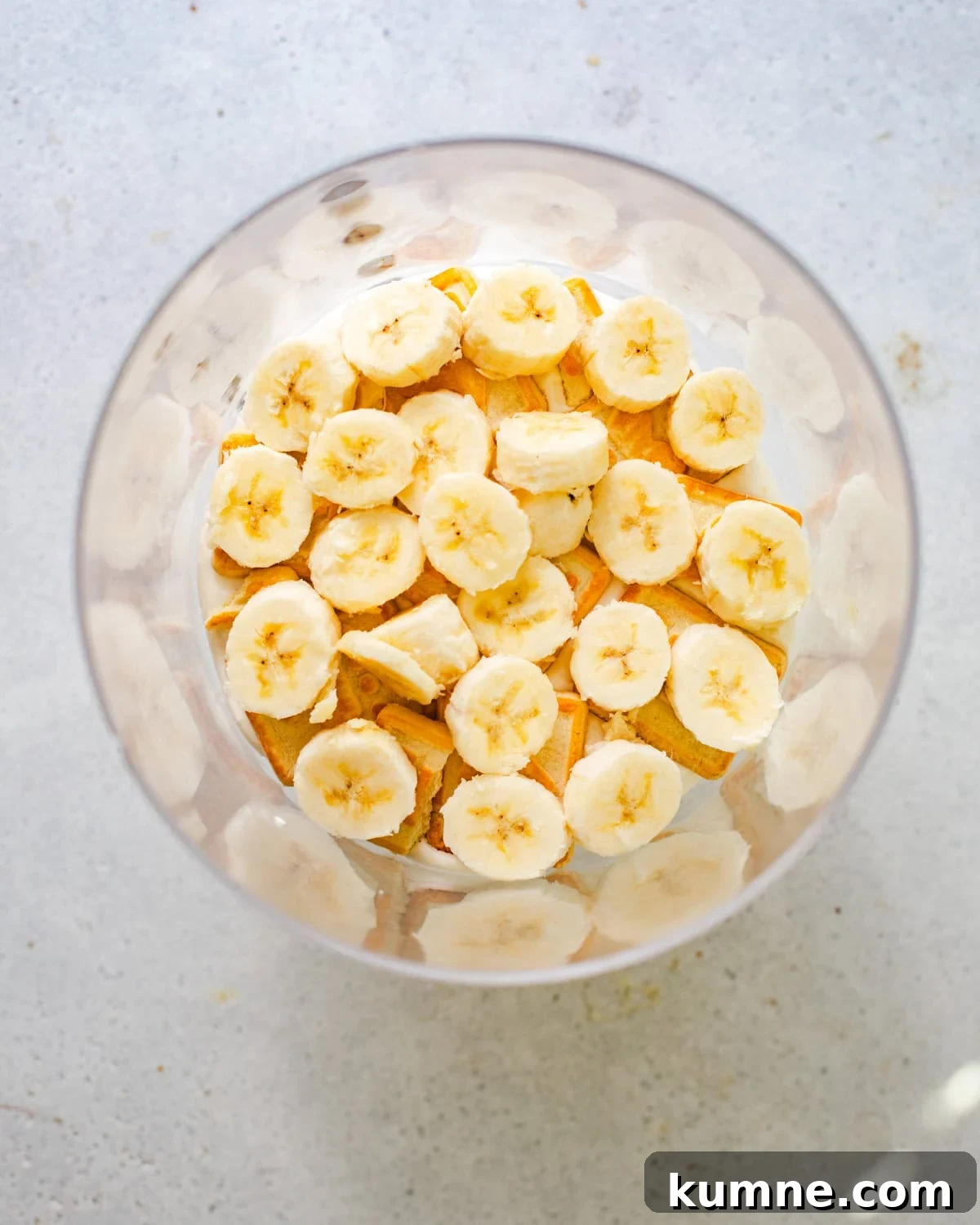 Homemade Banana Pudding Recipe: Classic from Scratch 9 sliced bananas in a trifle bowl on top of the cookies.