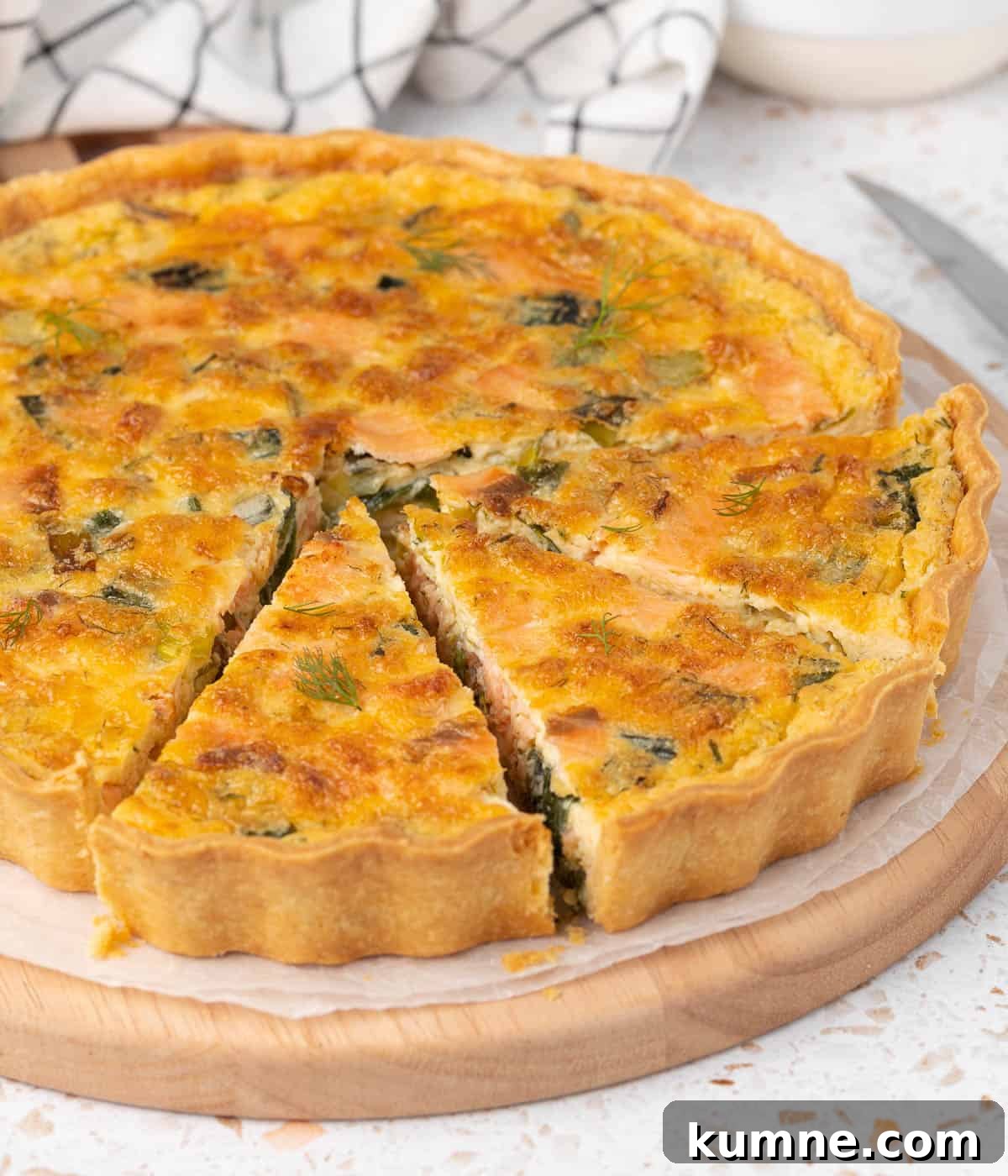 Smoked Salmon and Dill Quiche Recipe for Brunch 7 Side view on the quiche with 3 slices cut out.