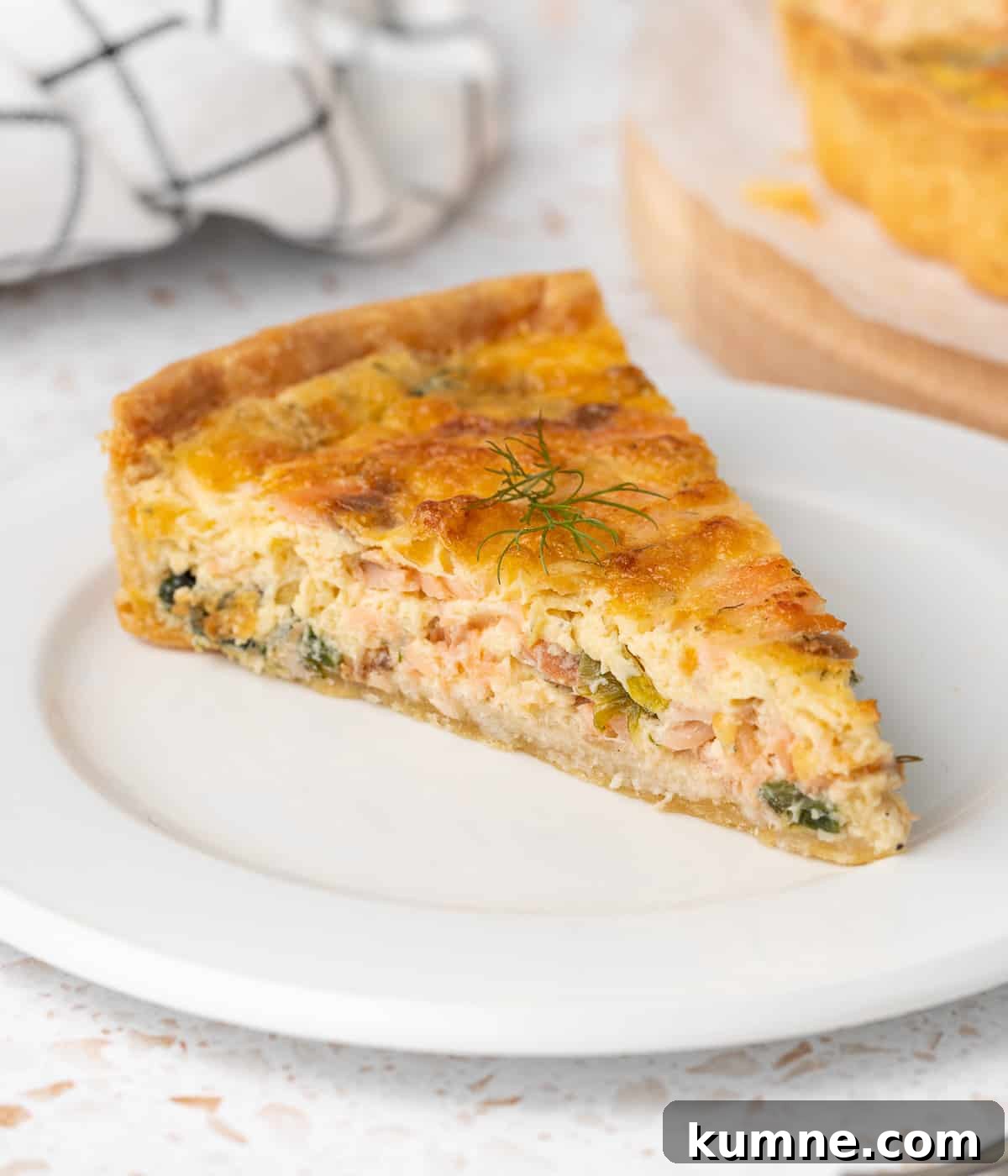 Smoked Salmon and Dill Quiche Recipe for Brunch 9 One slice on a small white plate.