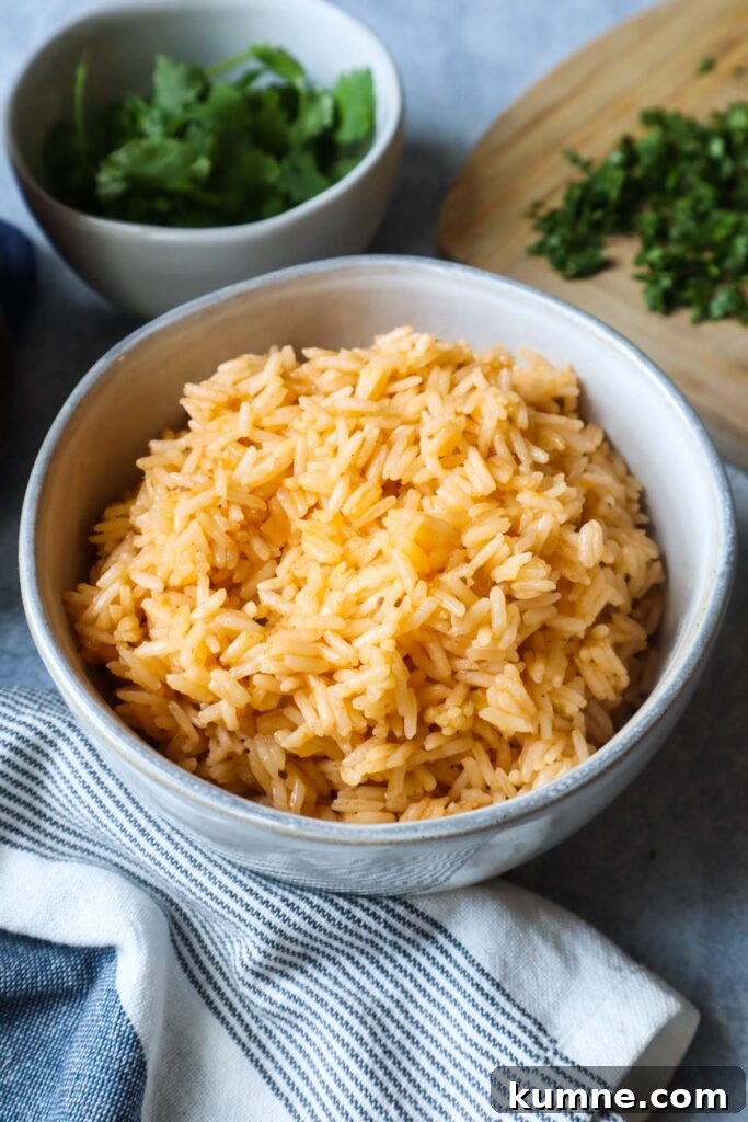 white bowl with bone broth rice and a cutting board with cilantro