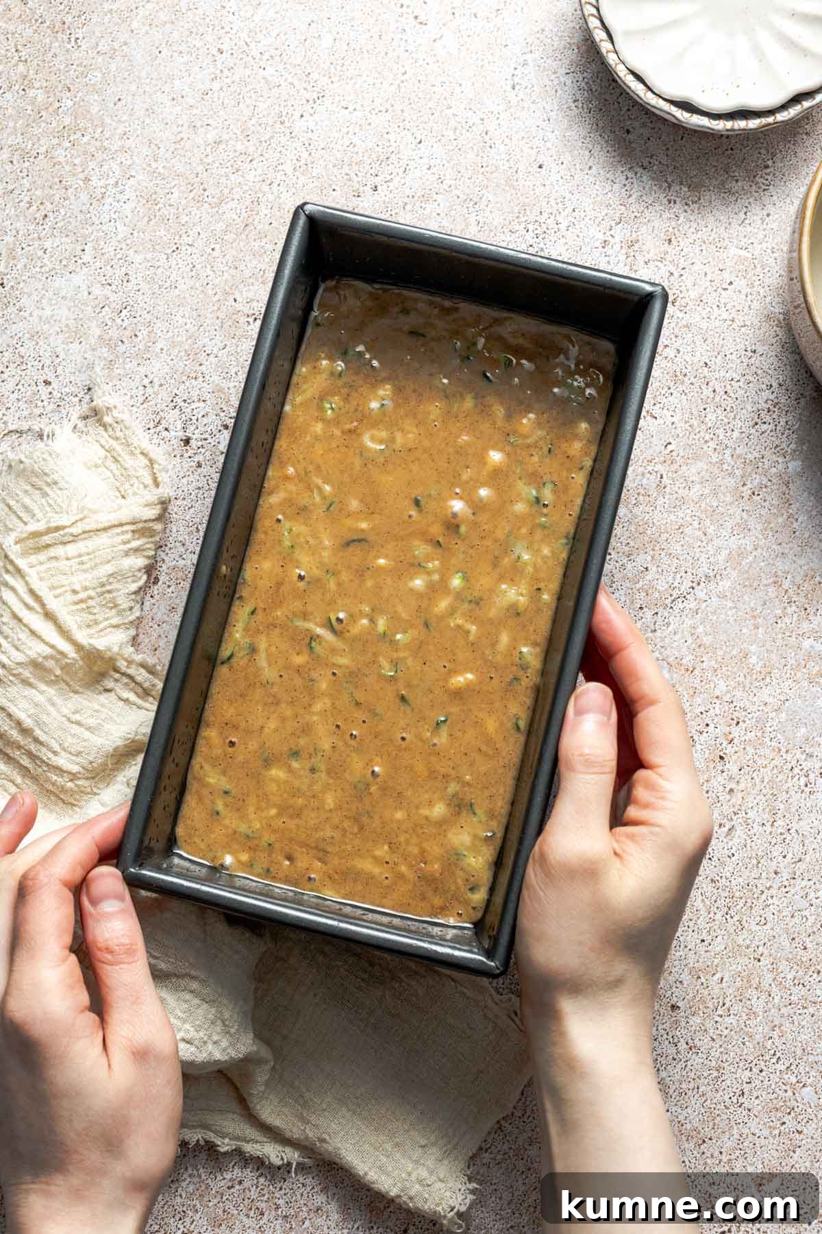 Moist Zucchini Bread Recipe with Cinnamon and Walnuts 6 zucchini bread batter in a loaf pan