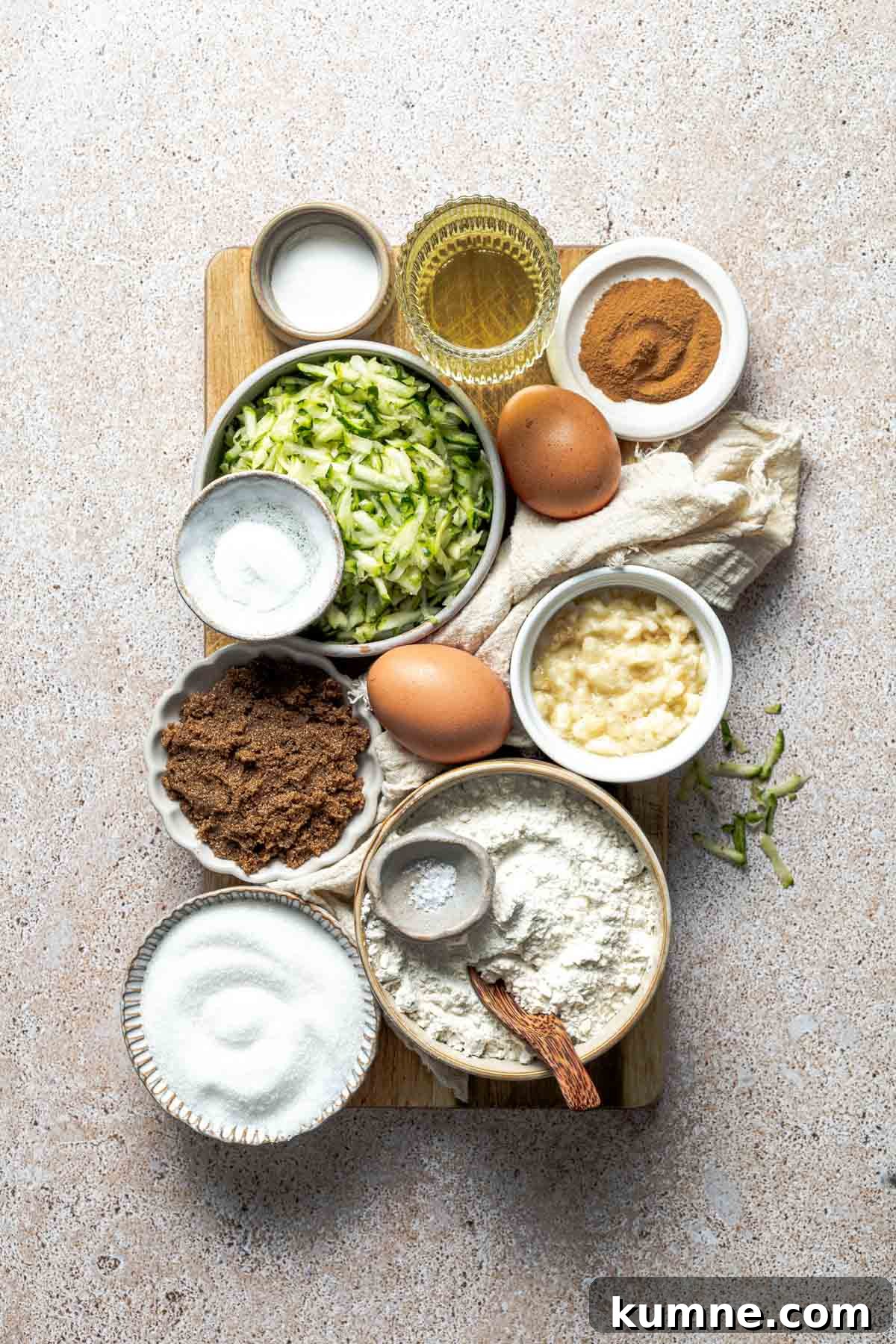 Moist Zucchini Bread Recipe with Cinnamon and Walnuts 3 sugar, salt, vegetable oil, cinnamon, eggs, mashed banana, shredded zucchini, brown sugar, all-purpose flour, baking powder, and baking soda.