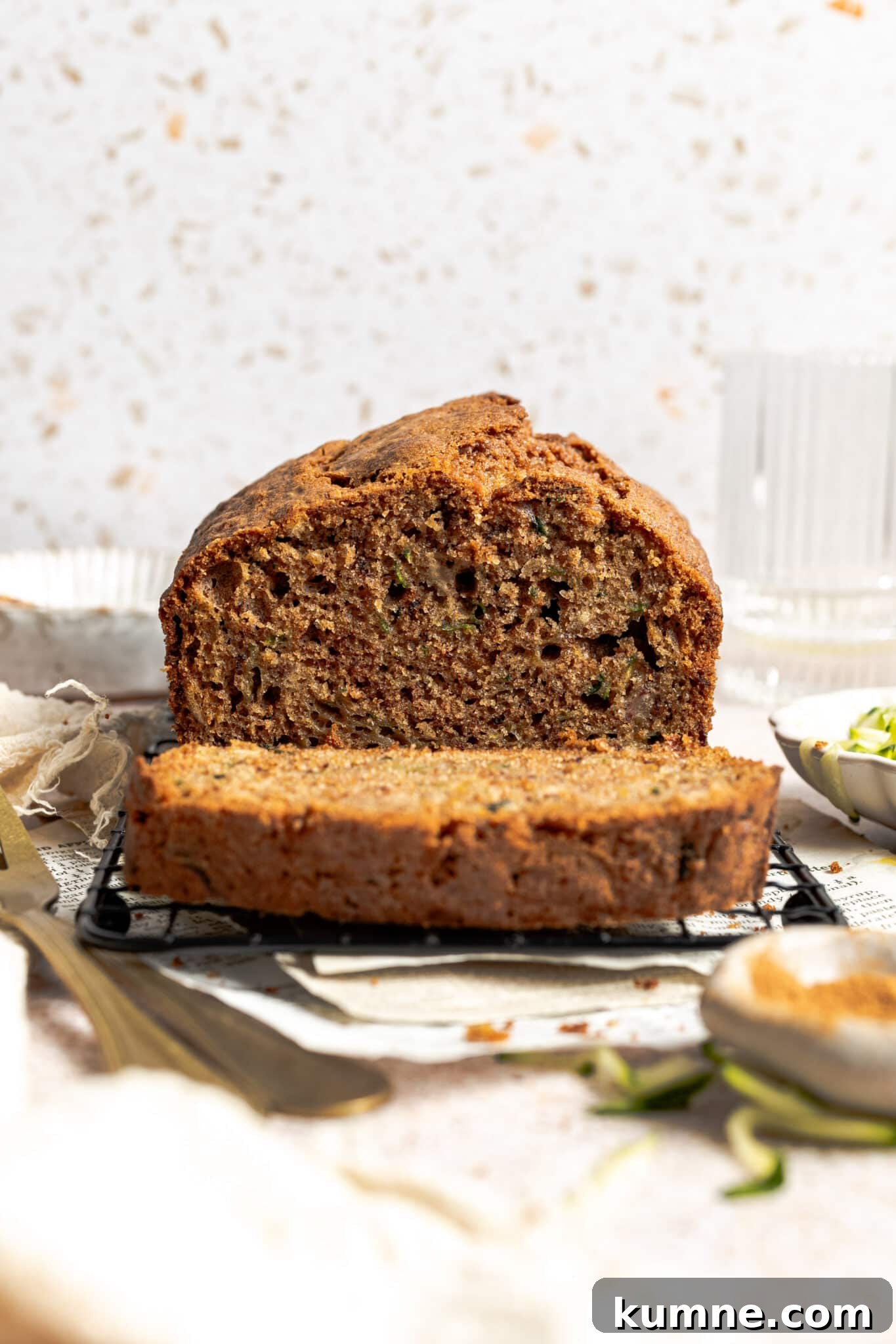 Moist Zucchini Bread Recipe with Cinnamon and Walnuts 4 a loaf of zucchini bread with a slice cut