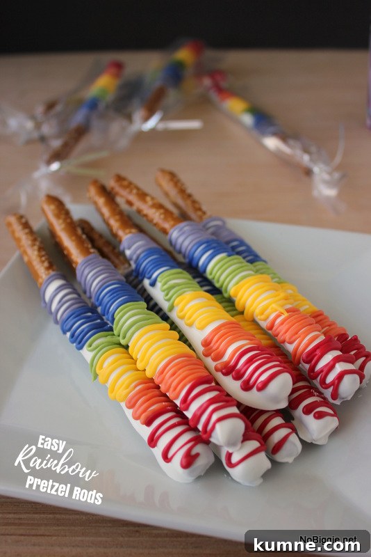 Chocolate-Covered Rainbow Pretzel Rods Recipe for Parties 2 Easy Chocolate Covered Rainbow Pretzel Rods | NoBiggie.net