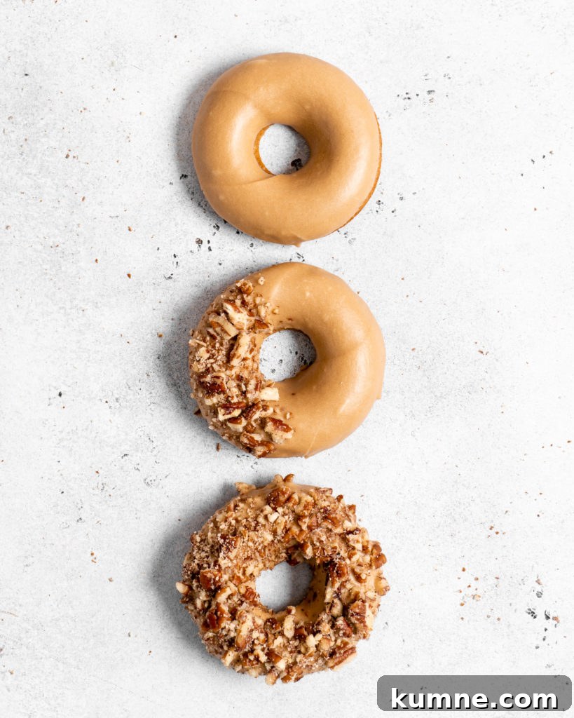 Baked Spiced Brown Sugar Donuts Recipe for Fall Flavor 6 Baked Spiced Brown Sugar Donuts are glazed in a butter maple glaze and garnished with a crushed pecan crust