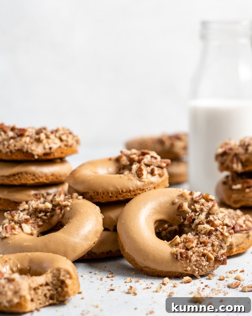 Baked Spiced Brown Sugar Donuts Recipe for Fall Flavor 7 Baked Spiced Brown Sugar Donuts are glazed in a butter maple glaze and garnished with a crushed pecan crust