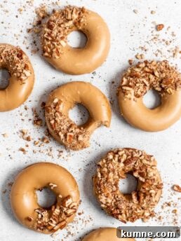 Baked Spiced Brown Sugar Donuts Recipe for Fall Flavor 9 Baked Spiced Brown Sugar Donuts are glazed in a butter maple glaze and garnished with a crushed pecan crust