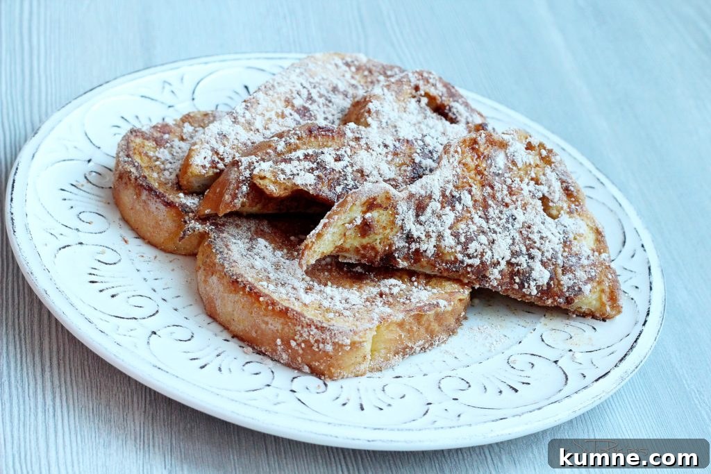 Classic Cinnamon Vanilla French Toast Recipe for Brunch 3 french toast covered with powdered sugar and cinnamon