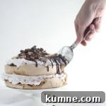 S'more pavlova- crispy brown sugar meringue, rich dark chocolate, and fluffy marshmallow frosting. Could s'mores get any better?! | The Simple, Sweet Life