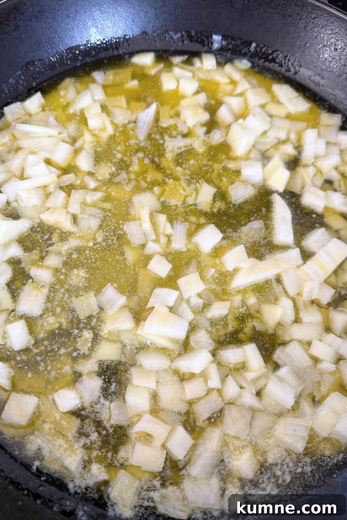 Creamy Baked Jalapeño Cheddar Corn Pudding Recipe from Scratch 4 Melted butter in a large skillet sautéing onion.