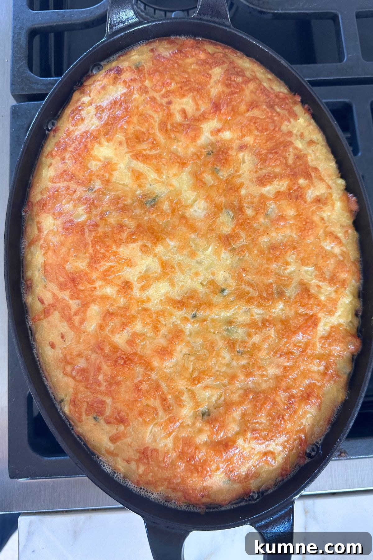 Creamy Baked Jalapeño Cheddar Corn Pudding Recipe from Scratch 8 Corn pudding with a golden brown topping, ready to slice and serve.