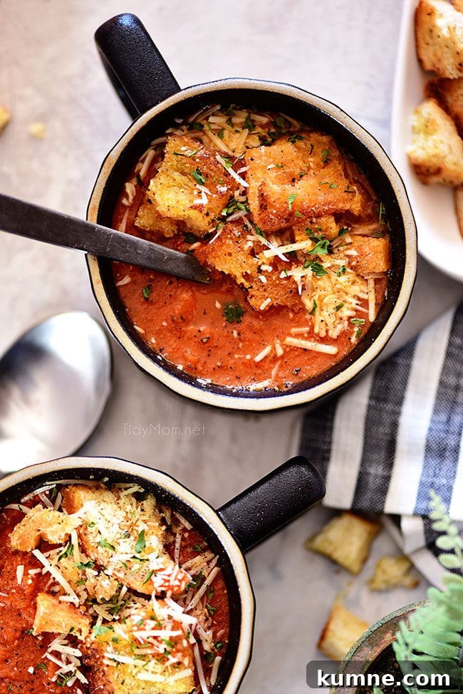 2 bowls of Roasted Tomato Soup in black mugs