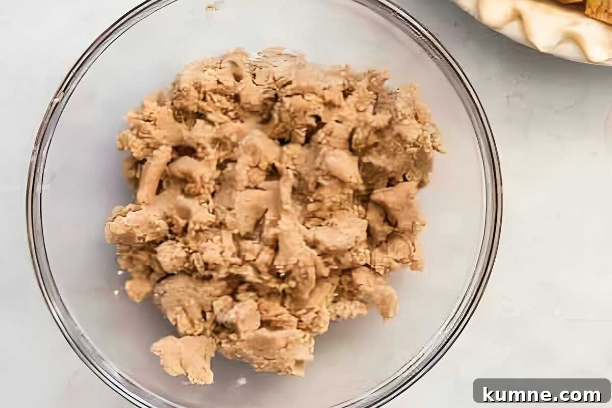 Authentic Dutch Apple Pie Recipe: Classic Ouderwets Appeltaart Guide 13 streusel topping mixed in a glass bowl.