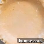 Authentic Dutch Apple Pie Recipe: Classic Ouderwets Appeltaart Guide 5 crimped pie crust in a pie dish.