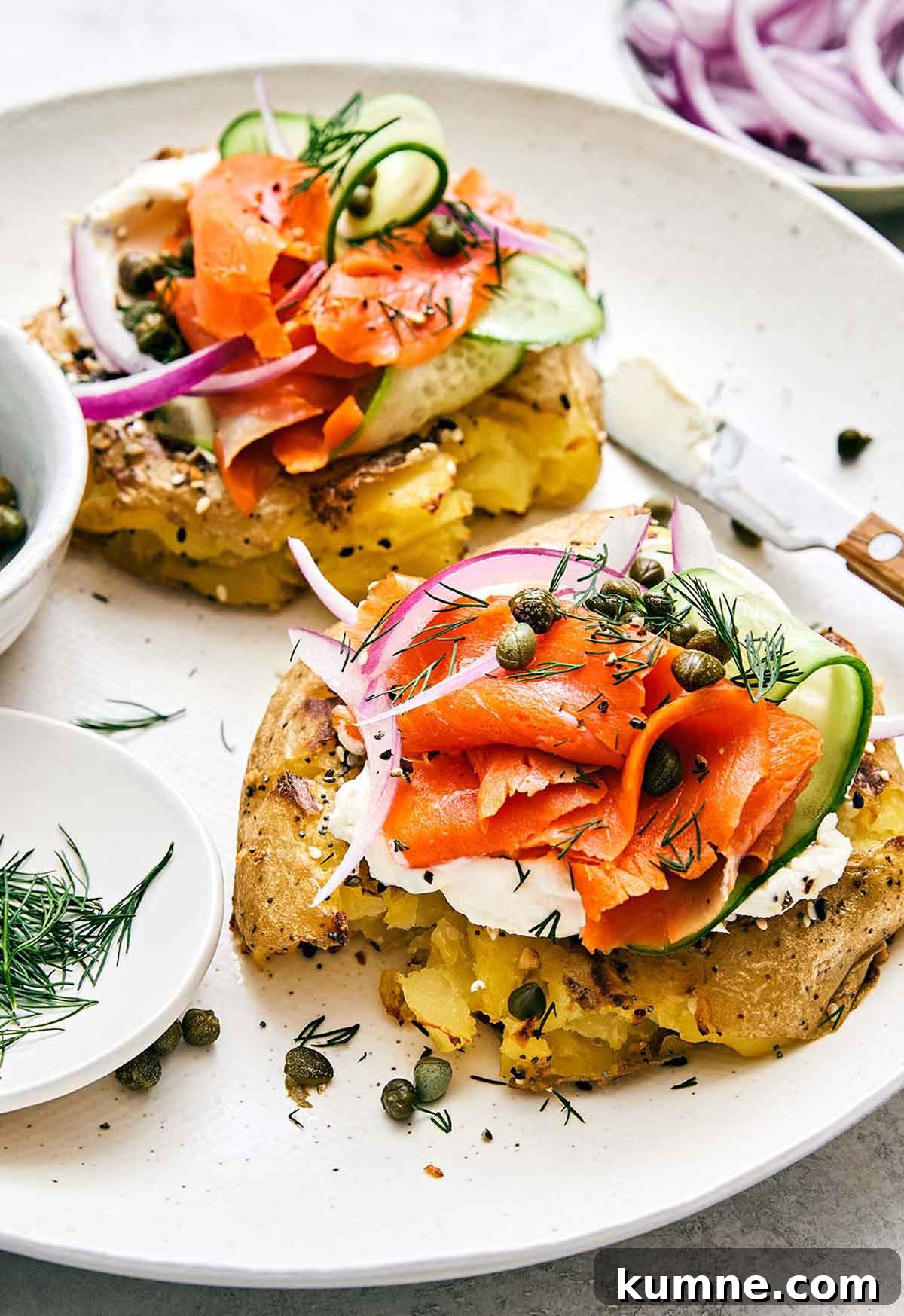 Healthy breakfast idea featuring a smoked salmon smashed potato bagel.