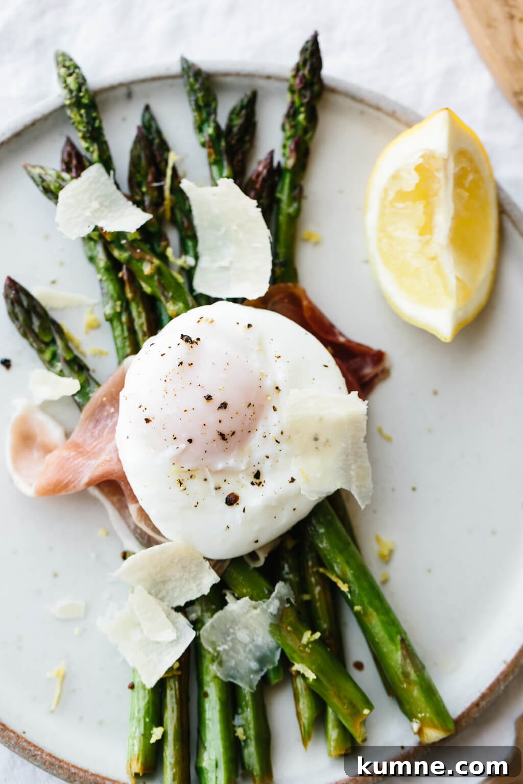 Breakfast doesn't get much better than garlic sautéed asparagus topped with prosciutto, a perfectly poached egg and a few shavings of parmesan.