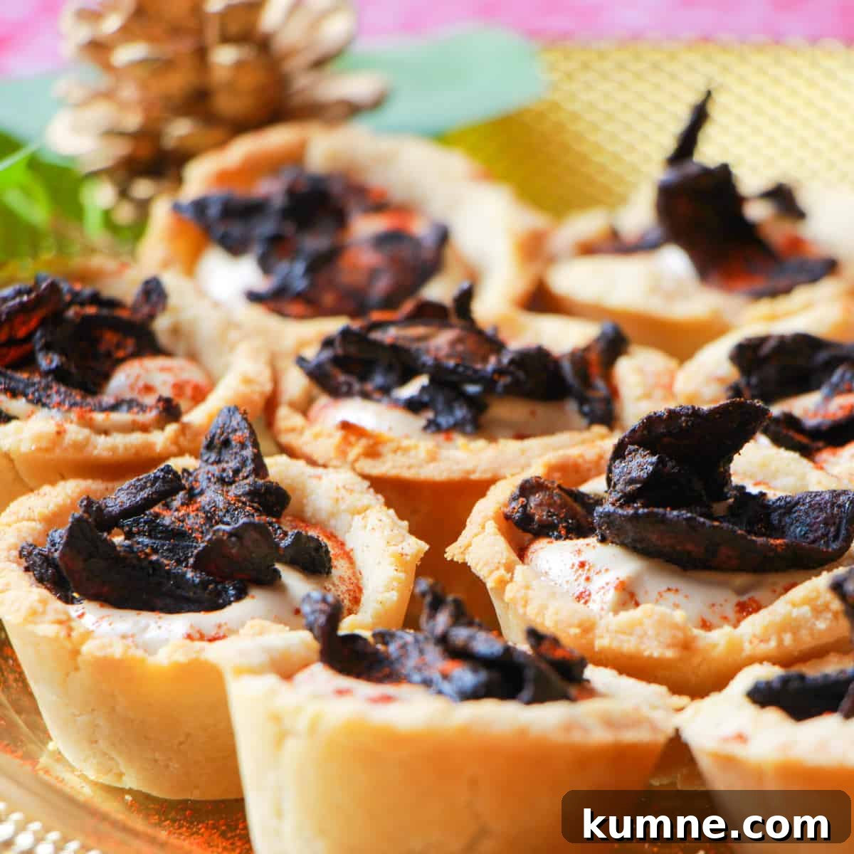 plate of mushroom bacon and black garlic cashew cream tartlets