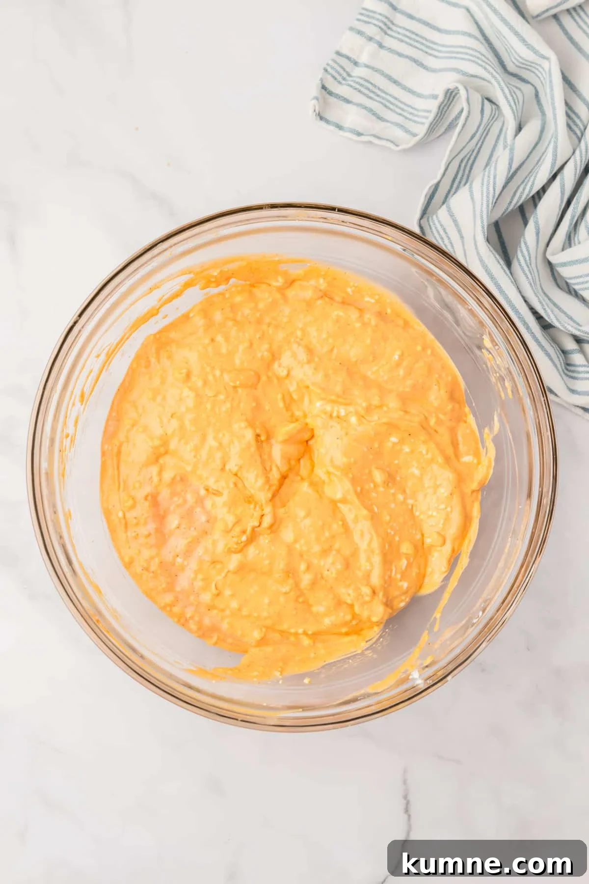 Slow Cooker Buffalo Chicken Dip Recipe for Game Day Snacks 6 A bowl with a cream cheese dip base inside.