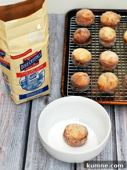Donut Holes with Three Irresistible Dipping Sauces for Brunch 4 #BrunchWeek continues with sweet sugar-covered fried donut holes, served with three dipping sauces: caramel, chocolate, and blackberry. Bet you can't stop at just one! theredheadbaker.com