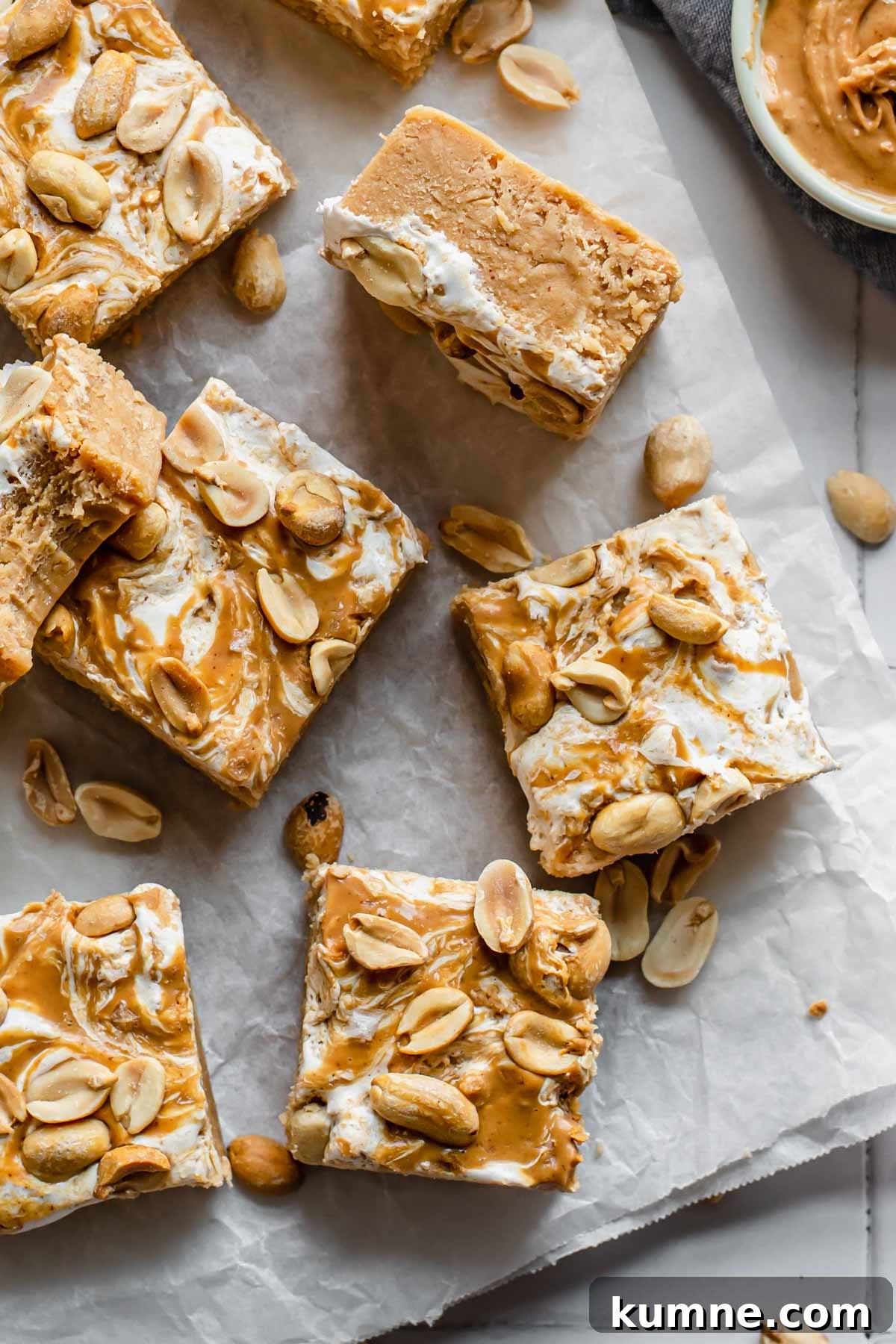 Peanut Butter Marshmallow Fluff Fudge (Fluffernutter) 2 Pieces of fluffernutter fudge strewn about.