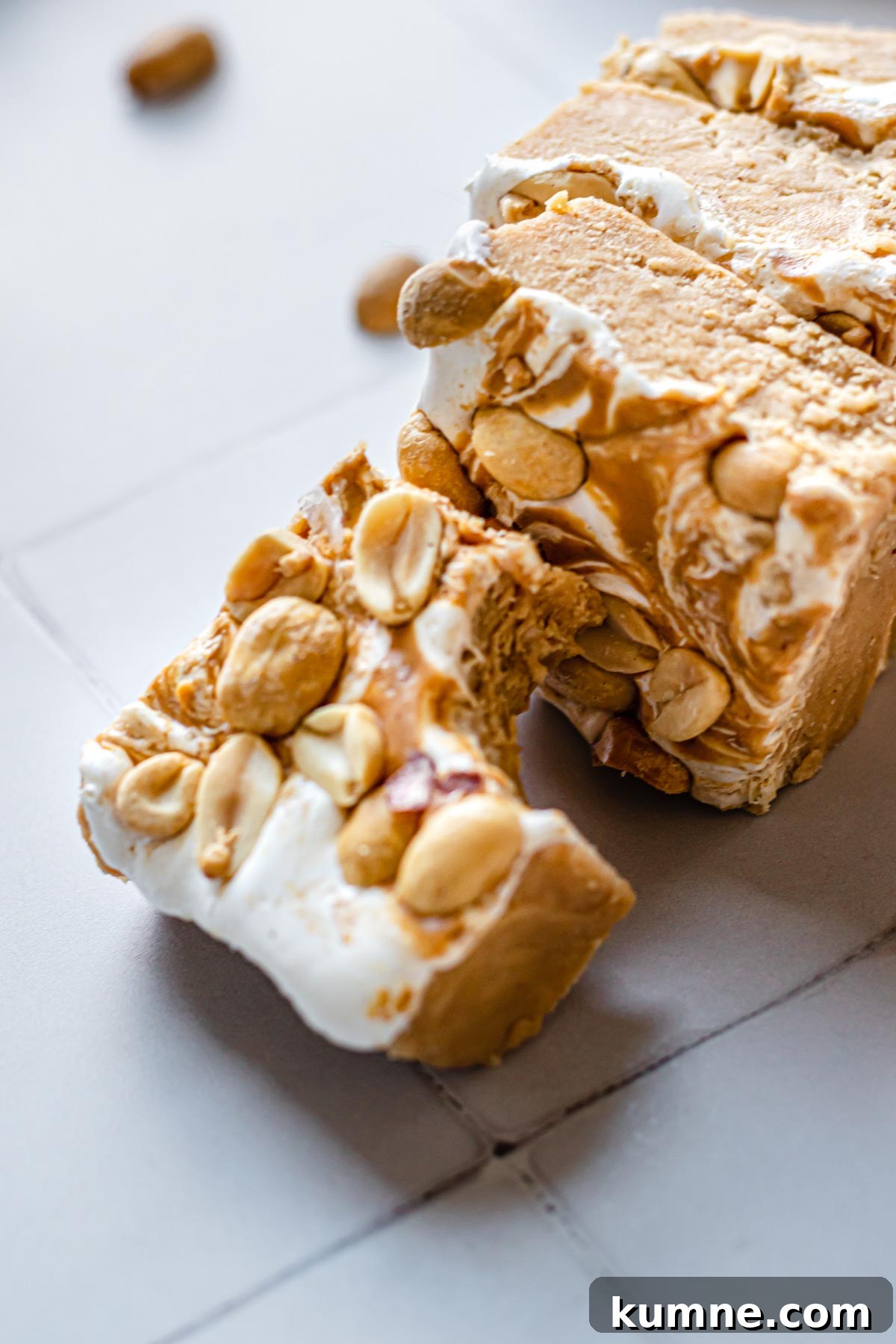 Peanut Butter Marshmallow Fluff Fudge (Fluffernutter) 3 Pieces of fudge laying on their sides.