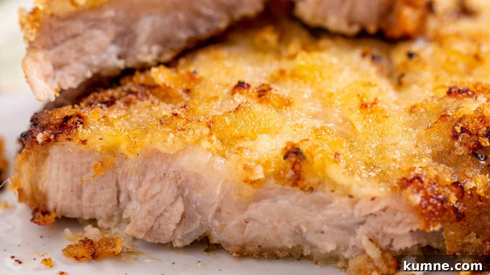 Panko pork chop on plate with greens.