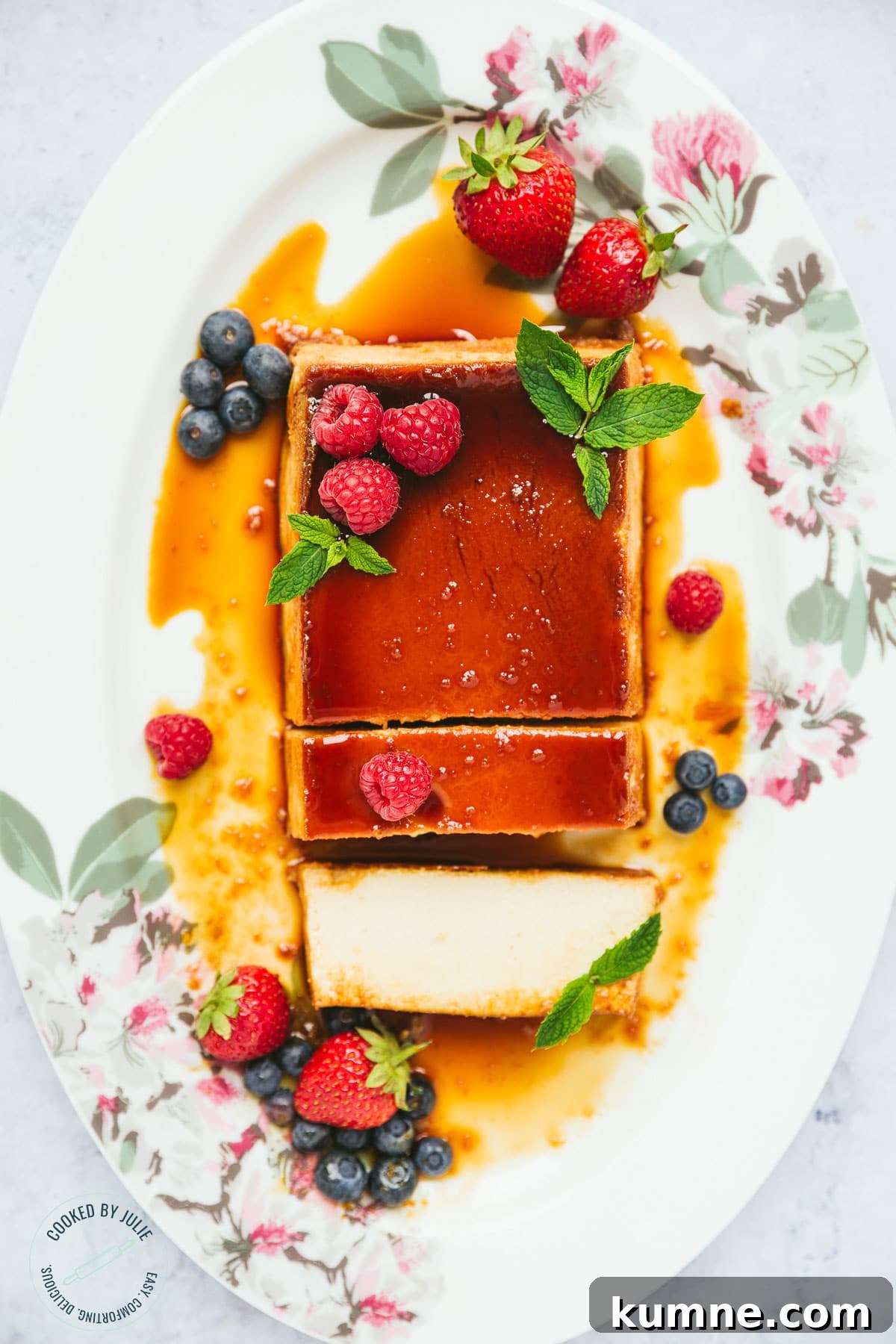flan with berries and mint, sliced into.