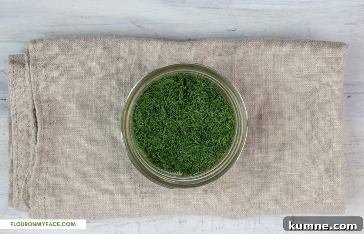 Dehydrated dill in a small glass jar.