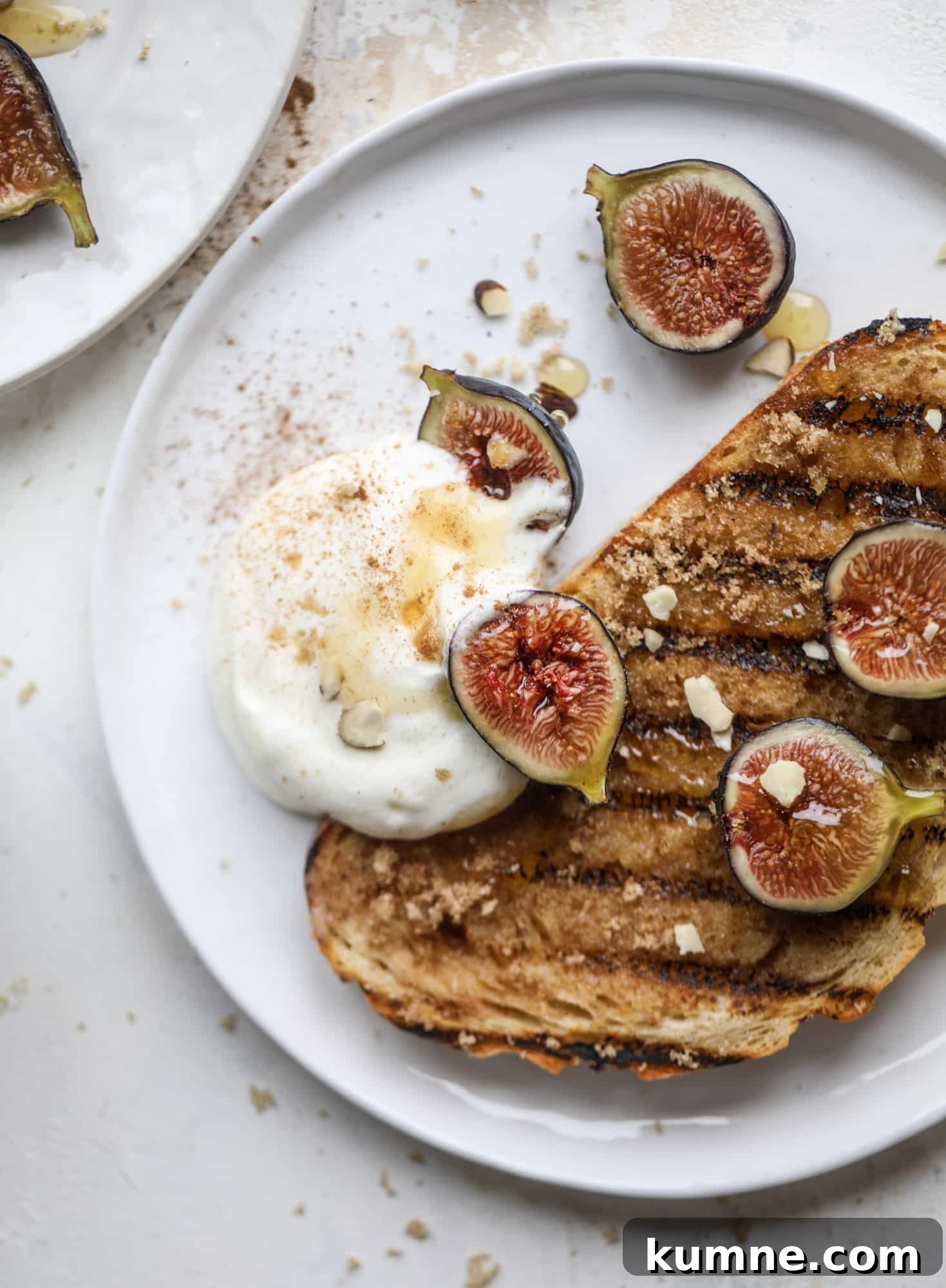 Grilled Cinnamon Toast with Fig & Ricotta Delight 7 This cinnamon sugar toast is an absolutely dream! It's spread with a cinnamon brown sugar butter, grilled to perfection and served with creamy whipped ricotta cheese, fresh figs, honey, cinnamon and sliced almonds. I howsweeteats.com #cinnamon #sugar #toast #ricotta #figs #breakfast