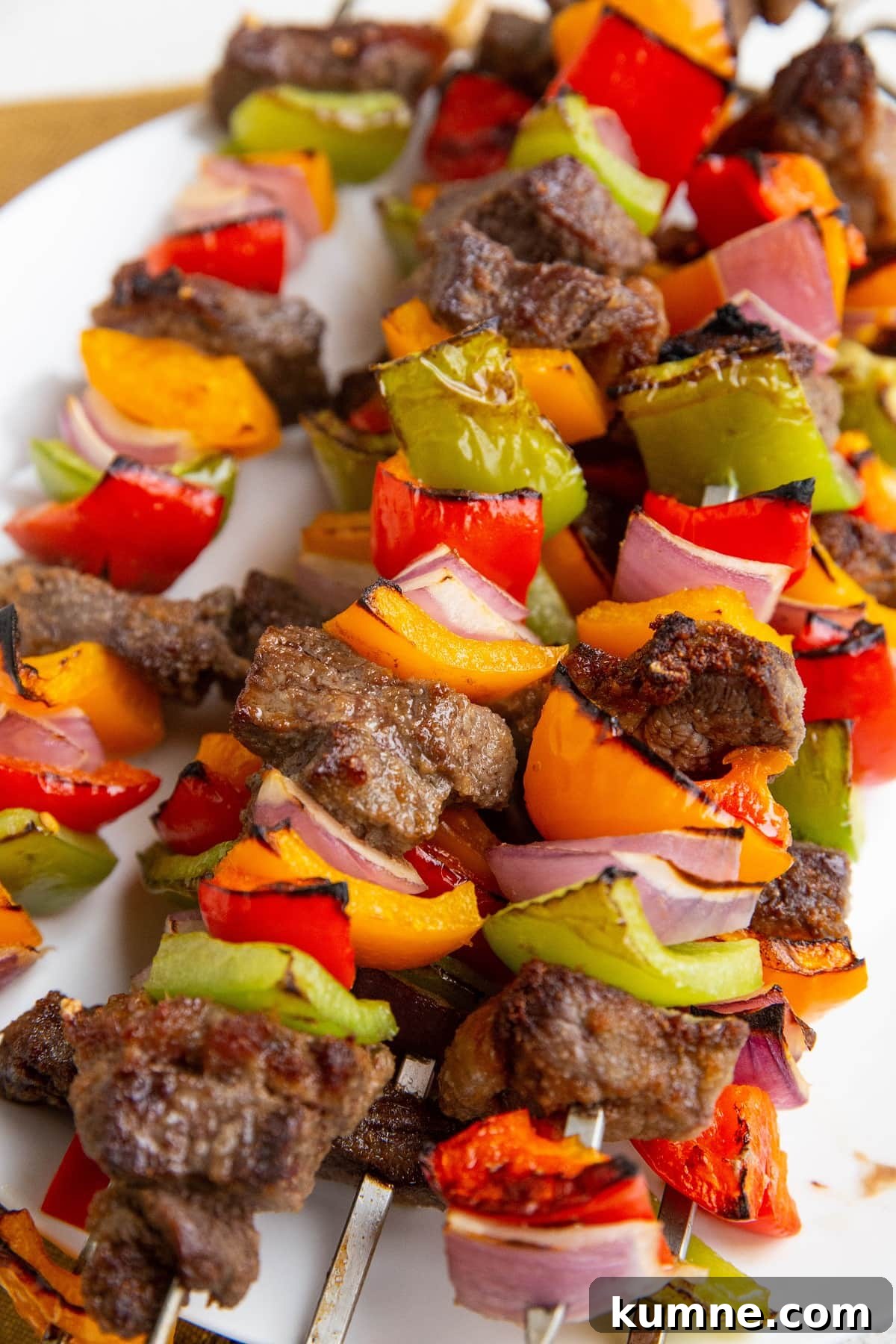 38-Day Balanced Meal Plan for Lasting Energy and Weight Control 4 Beef kabobs on a plate, ready to serve.