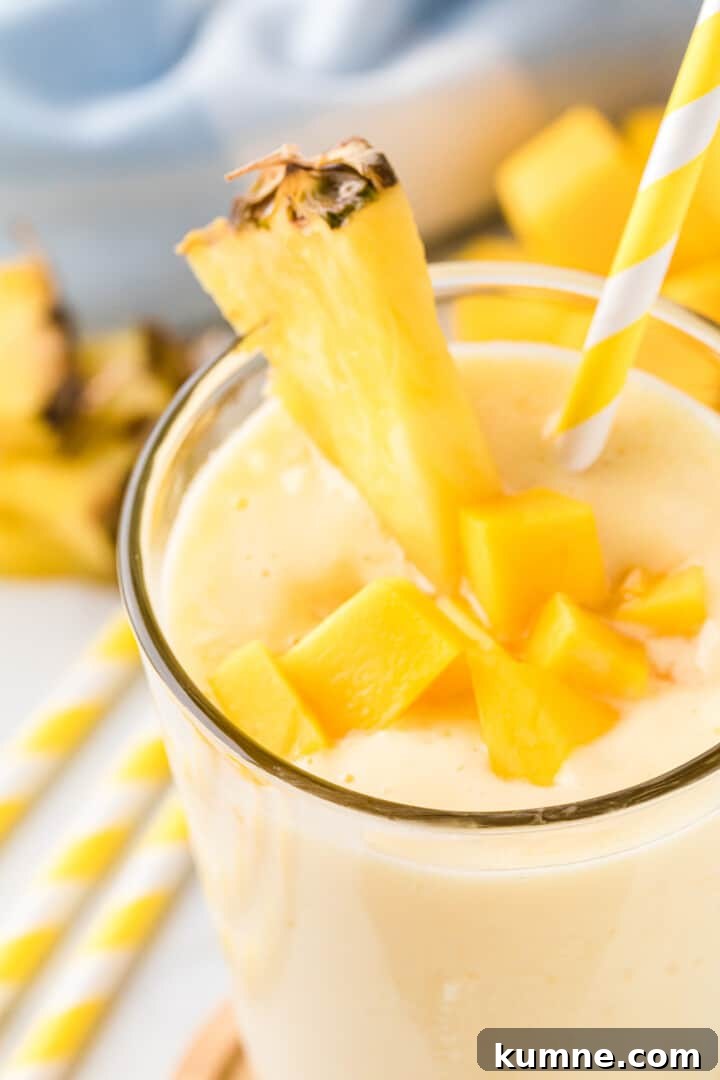 Creamy Mango Pineapple Smoothie Recipe for Tropical Refreshment 3 closeup of the Mango Pineapple Smoothie in glass.