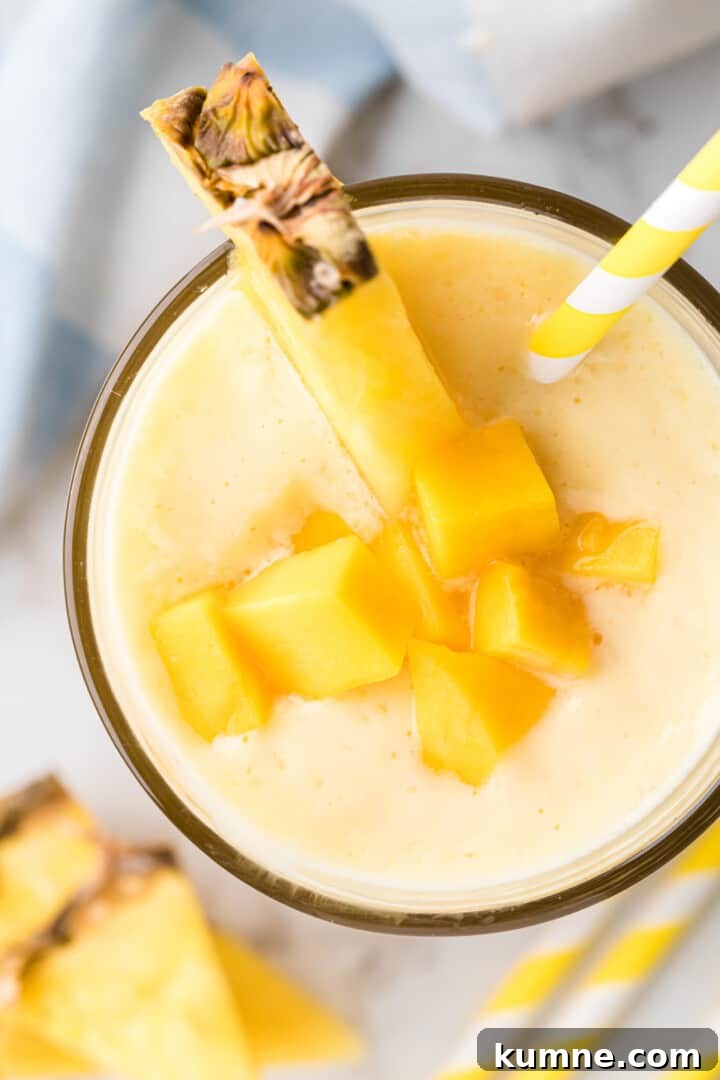 Creamy Mango Pineapple Smoothie Recipe for Tropical Refreshment 9 top view of the smoothie.