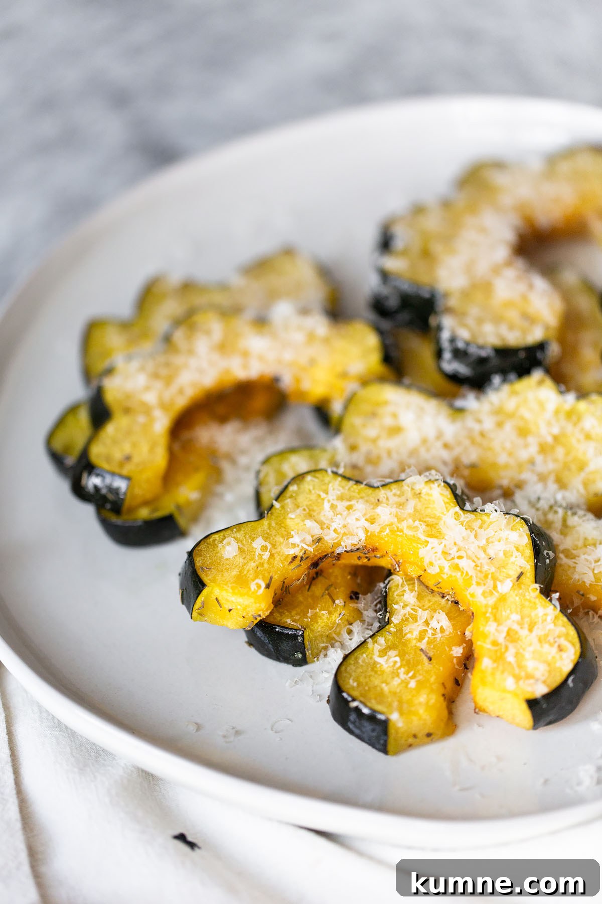 Crispy Roasted Acorn Squash with Parmesan and Herbs 8 oven roasted acorn squash slices with parmesan cheese