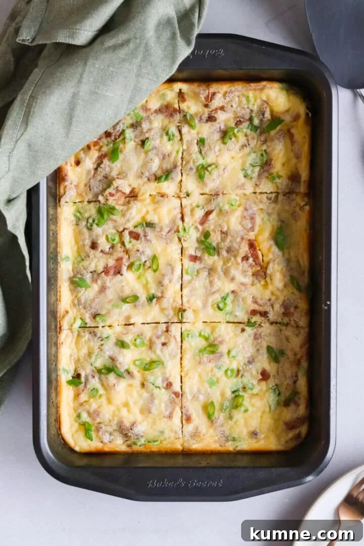 Cottage Cheese Frittata with Eggs and Herbs 3 Cottage cheese egg bake frittata sliced in a large baking pan and topped with green onions