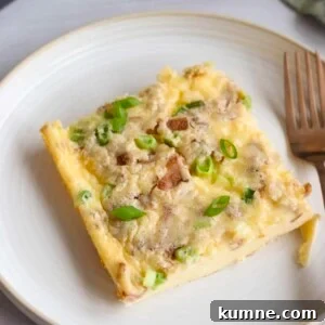 Cottage Cheese Frittata with Eggs and Herbs 9 Slice of cottage cheese egg bake on a white plate, garnished with sliced green onions
