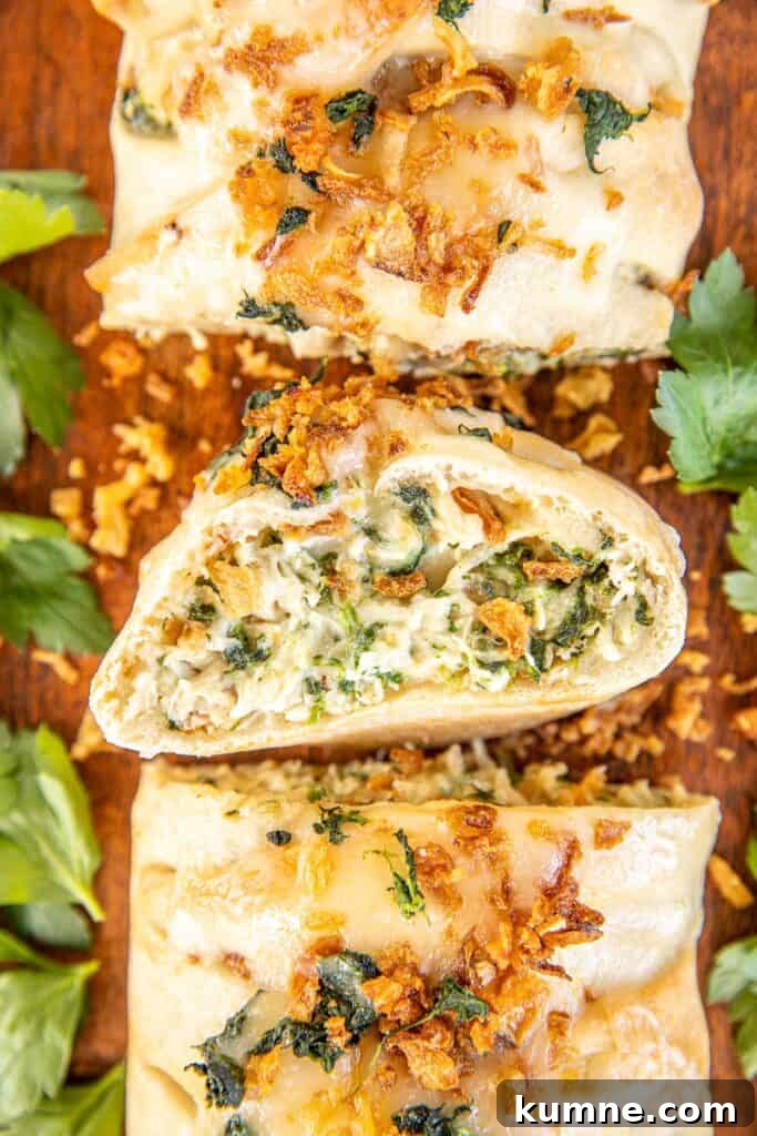 Cheesy Monterey Chicken Braid Recipe: Savory Stuffed Bread 4 cross section of cheesy chicken and spinach braid