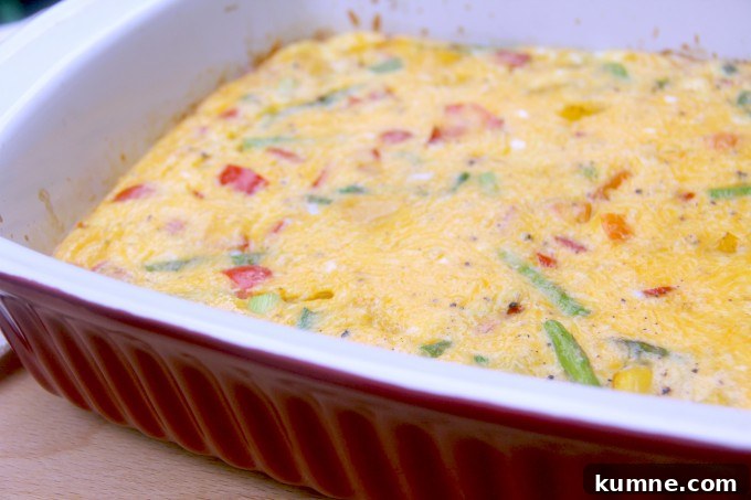 Side view of a baked frittata with vegetables.